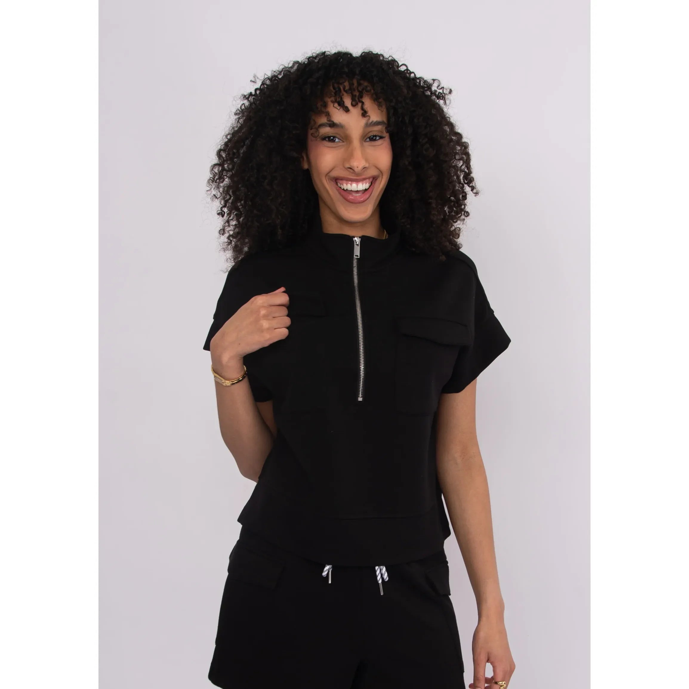 dua-1-2-zip-short-sleeve-top-black-1.jpg